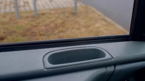 Closeup of car door handle. Inside view of parked vehicle door details Vidéo 333910350