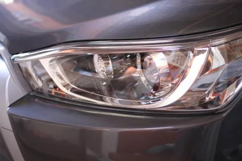 Closeup of car headlight background Stock Photos