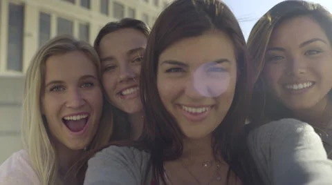 Closeup Of Carefree Teen Girls Making Funny Faces And Smiling For Selfies (4K) Stock Footage