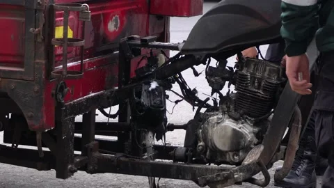 Closeup of a cargo motorcycle burned by spontaneous fire and leaking gasoline 스톡 동영상 161267321