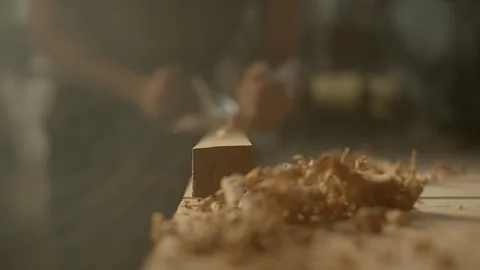 A closeup of a carpenter with a planer at work in his workshop. Stock Footage 148538403