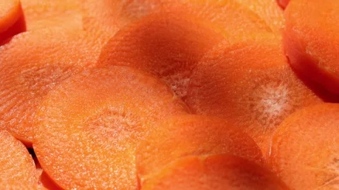 Closeup of a carrot on wooden backdrop Video stock 302536645
