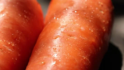 Closeup of a carrot on wooden backdrop Video stock 302536749