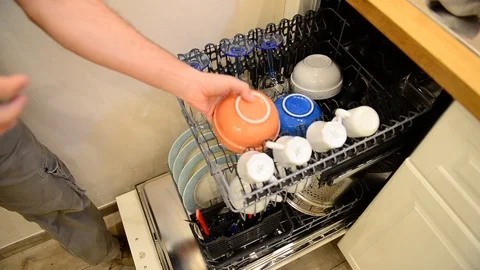 Closeup of caucasian man loading dish washer 스톡 동영상 122203875