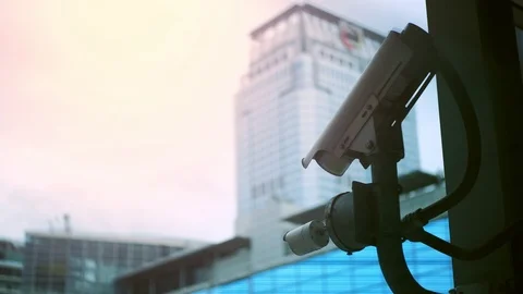 Closeup of cctv camera for traffic and security in urban city. blurred city back 動画素材 114144745