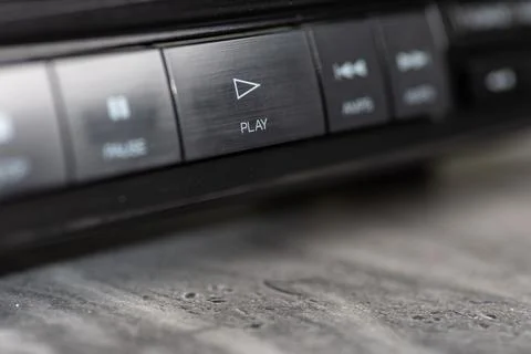 Closeup Of CD Player Play Button On Metallic Dashboard Control Panel Stock Photos