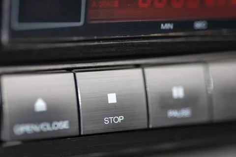Closeup Of CD Player Stop Button On Metallic Dashboard Control Panel Stock Photos