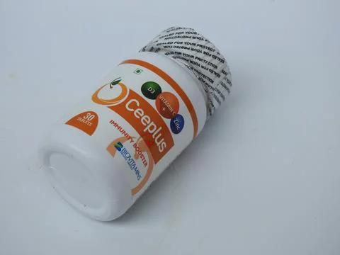 Closeup of Ceeplus Immunity Booster Tablets Plastic Container isolated on whi 写真素材