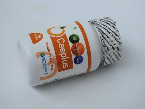 Closeup of Ceeplus Immunity Booster Tablets Plastic Container isolated on whi 스톡 사진