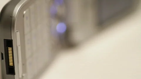 Closeup of cel phone rack focus from connector to keypad Stock Footage 526497