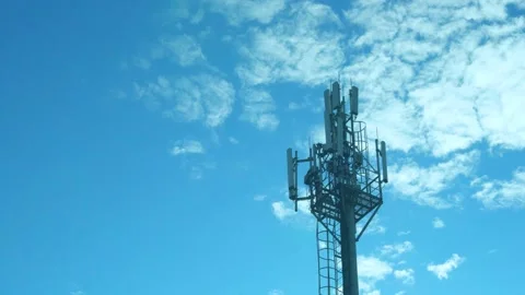 Closeup Cellular Communication Station, Cell Tower on a Sunny Day Blue Sky White Stock Footage 224466262