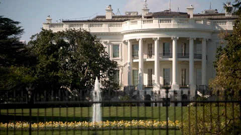 Closeup off center composition of the White House oval office with fountain in Stock Footage 128323646