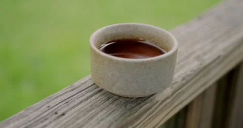 Closeup of ceramic cup filled with freshly brewed Pu-erh... Stock Footage 316914538