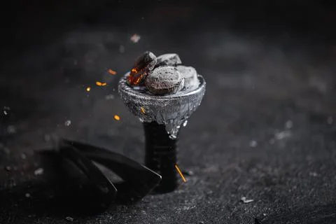 Closeup of a ceramic hookah or waterpipe head with alufoil or thin foil Stock Photos
