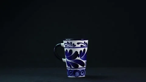 Closeup of a ceramic Talavera cup isolated on a black background Stock Footage 149207673