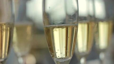 Closeup of champagne bubbles in elegant flutes Stock Footage 312829797