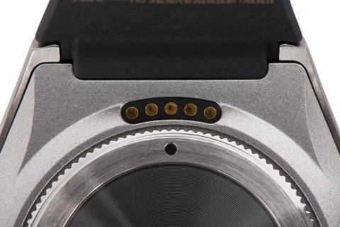 Closeup of charge terminal on the back of smart watch. Stock Photos