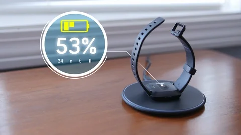 Closeup Charging Smart Watch on Wireless Charging Mat with Graphics Vídeo Stock 103046289