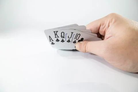Closeup of checking playing cards isolated on white Stock Photos