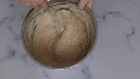 Closeup of chef beating cake batter with metal whisk Stock Footage 139260097