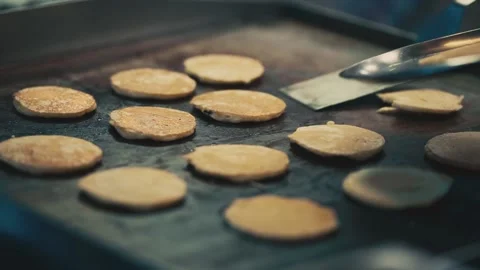 Closeup of Chef cooking pancakes in the kitchen of restaurant Stock Footage 130673345