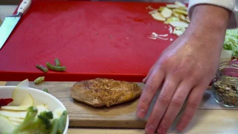 Closeup of chef cutting chicken on the board Stock Footage 77036823