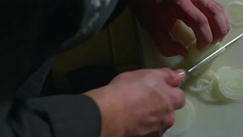 Closeup of chef cutting onions in kitchen 스톡 동영상 233762294