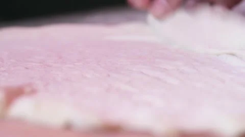 Closeup chef flours surface counter stretches pizza dough Vídeos de archivo 40769946