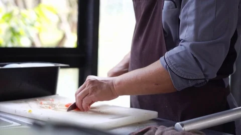 Closeup chef hand cutting tomato preparing for cooking, slow-motion Stock Footage 122145758