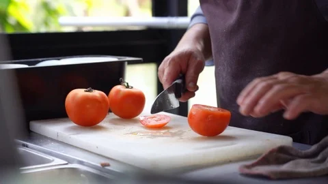 Closeup chef hand cutting tomato preparing for cooking Video stock 122195543