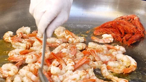 Closeup chef hands cooking squid in a pan Video stock 112714495