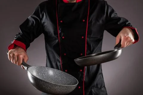 Closeup of chef holding empty frying pan 스톡 사진