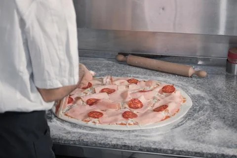 Closeup chef making pizza Stock Photos