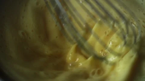 Closeup chef whisk beats eggs in cream for cake Stock Footage 131096481