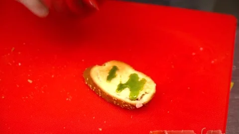 Closeup of the chef's hands in gloves making tapas Stock Footage 77029701