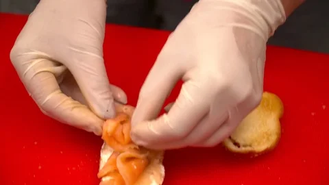 Closeup of chef's hands making tapas on the kitchen Stock Footage 77029616