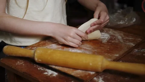 Closeup child makes homemade flatbread from wheat flour with gluten, slow-motion Stock Footage 205023570