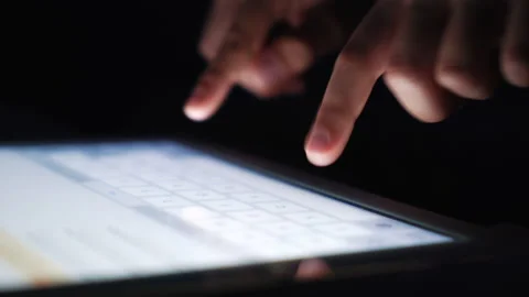 Closeup child texting message on tablet in the dark Stock Footage 171807236