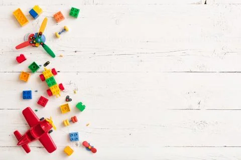 Closeup of children multi-color plastic bricks with wooden cubes figures 2019 Stock Photos