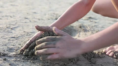 Closeup of childrens hands playing with sand on summer beach. Vacation concept. Stock Footage 266749744