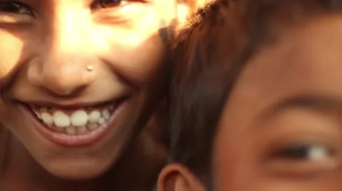 Closeup of childrens smiling faces in an Indian village school close up tilt Stock Footage 65783477