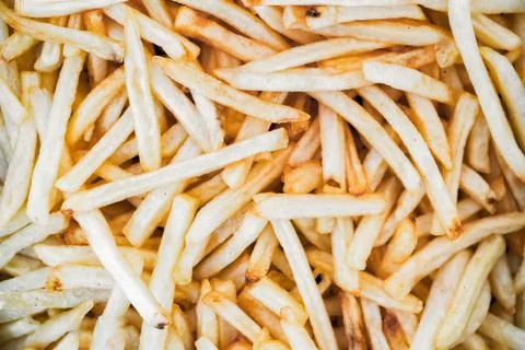 Closeup chips in fish and chips dish Stock Photos