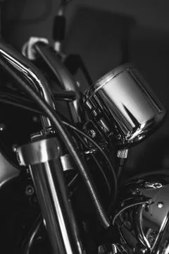 Closeup of chopper's chrome handlebar, fork, and actuator. Black and white Stock-Fotos