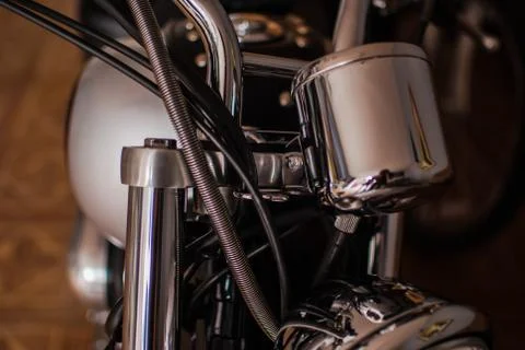 Closeup of chopper's chrome handlebar, fork, and actuator Stock Photos