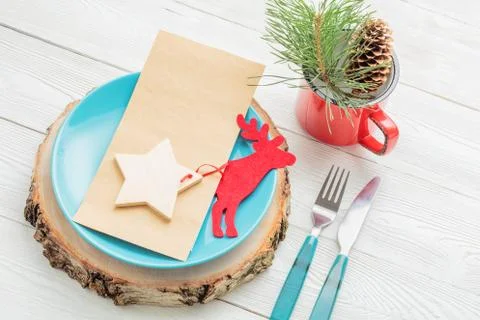 Closeup of Christmas dinner table setting on white background Stock Photos
