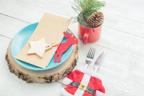 Closeup of Christmas dinner table setting on white background Stock Photos