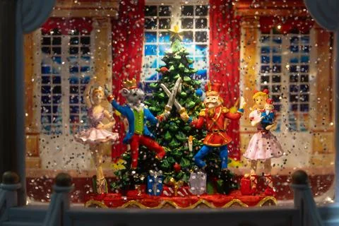 Closeup of Christmas Globe with  Nutcracker figures in winter snow Stock Photos