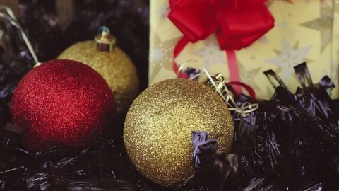 Closeup of Christmas globes and present Stock Footage 80350746
