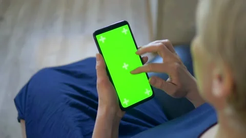 Closeup. chroma key screen of a smartphone. woman uses cell phone Stock Footage 130403509
