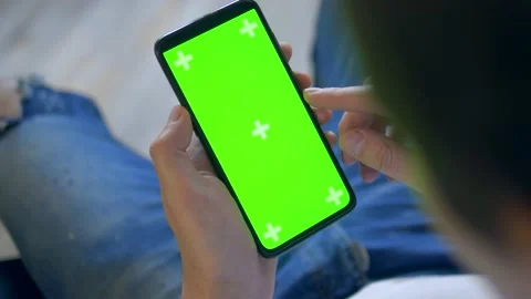 Closeup. chroma key screen of a smartphone. man uses cell phone Stock Footage 130965550